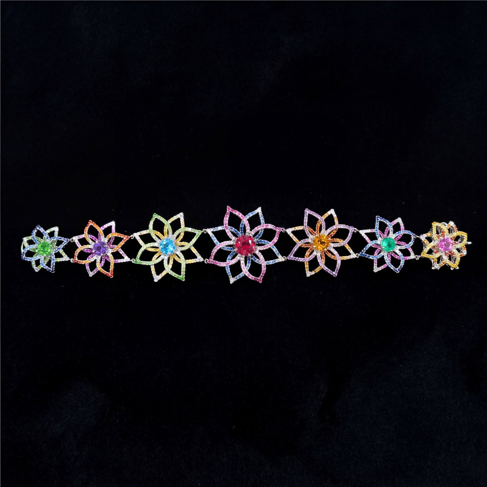 13.2 ctw Ruby and 1.35 ctw White Diamond Platinum Bracelet: Retail Value: $34,560 Exuding opulence and grace, this exquisite Spider bracelet featuring Ruby, Blue Sapphire, Citrine, White Diamond, Tsavorite is crafted for the distinguished. Crafted with precisi
