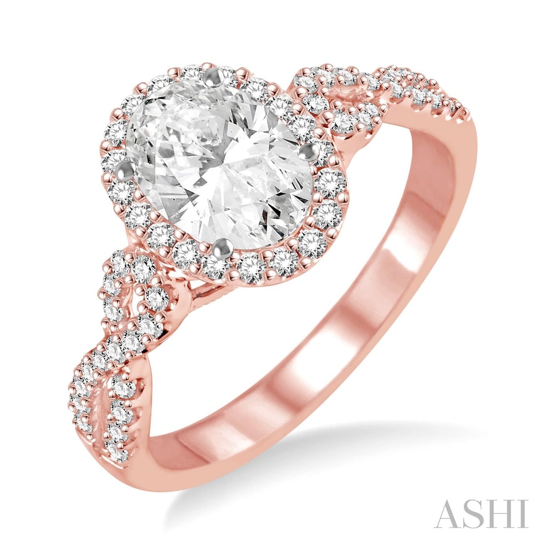 0.57 ctw Oval Diamond 14K Rose & White Gold Engagement Ring: Exuding opulence and grace, this breathtaking Halo ring featuring White Diamond is crafted for the distinguished. A detailed Halo gallery secures the stones, rendered in 2.25 grams of lustrous 14K Ros