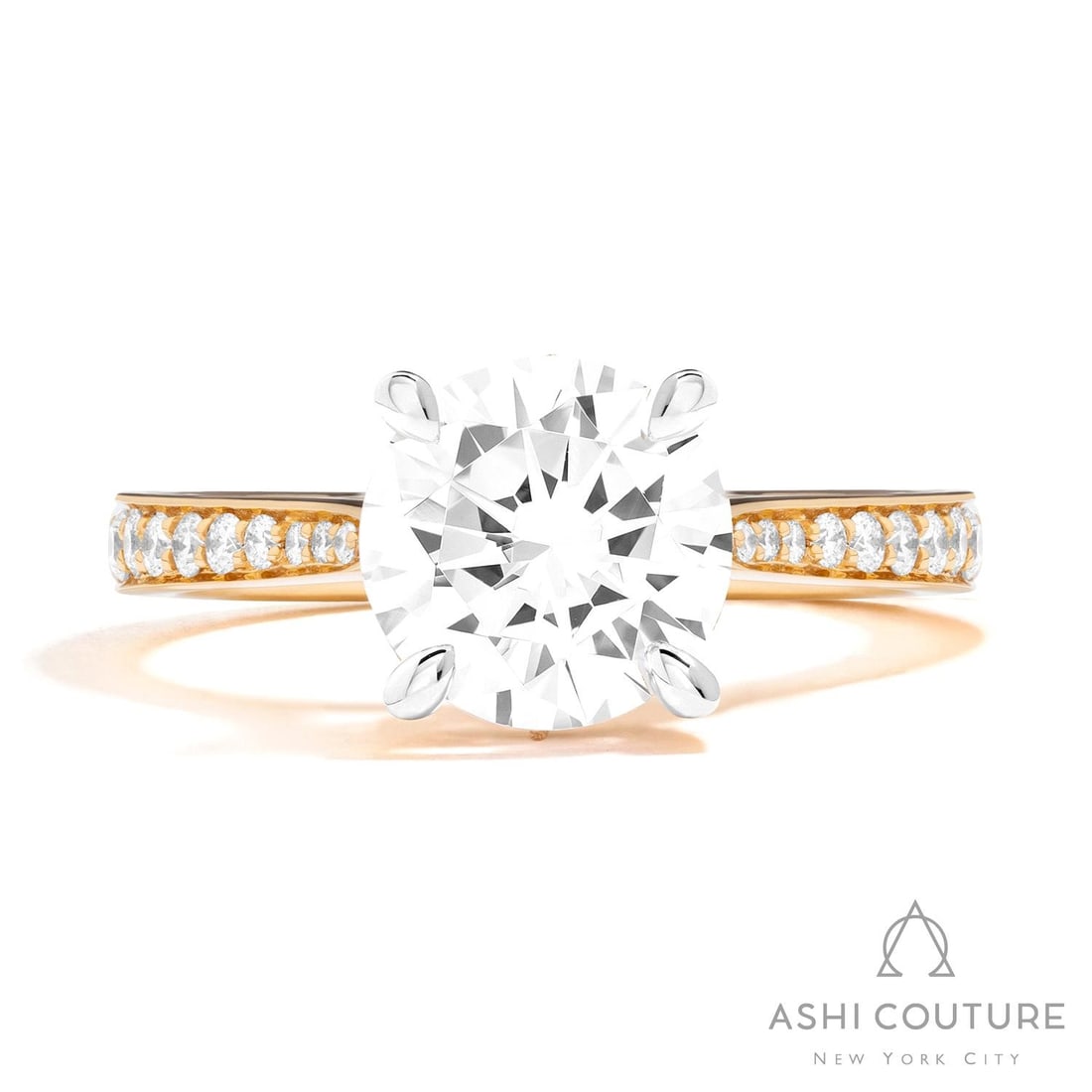 0.61 ctw White Diamond 18K Yellow & White Gold Engagement Ring: Defining modern elegance, this stunning Channel/Prong Set Diamond Shank ring featuring White Diamond captures the essence of style. The gemstones are nestled within a Solitaire framework, supported by