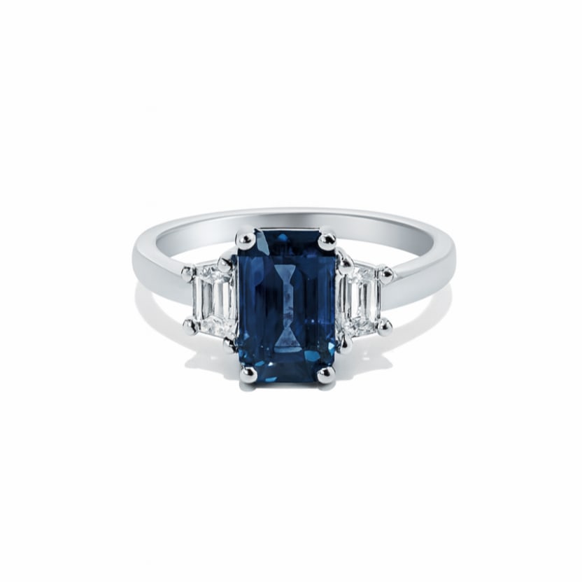 3.10ct Sapphire and 0.47ctw Diamond Platinum Ring: Epitomizing grandeur, this magnificent Three stone ring featuring Blue Sapphire, White Diamond stands as a beacon of refined taste. Showcasing the gems in a Three-Stone arrangement, the ring consists 
