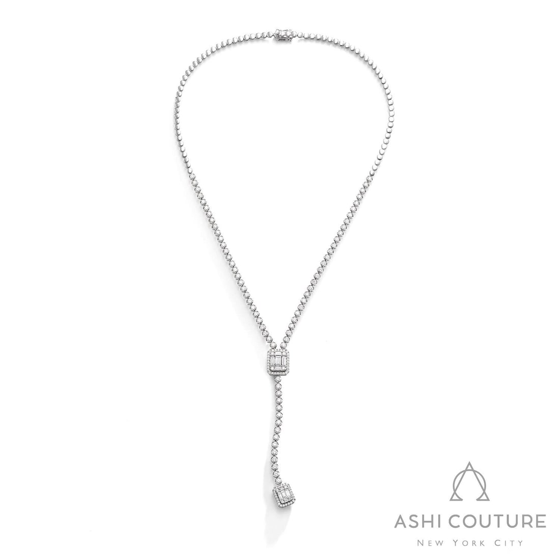 5.26 ctw Diamond Baguette 18K White Gold Lariat Necklace: Exuding opulence and grace, this breathtaking Empress Lariat necklace featuring White Diamond is crafted for the distinguished. Showcasing the gems in a Lariat arrangement, the necklace consists of 25