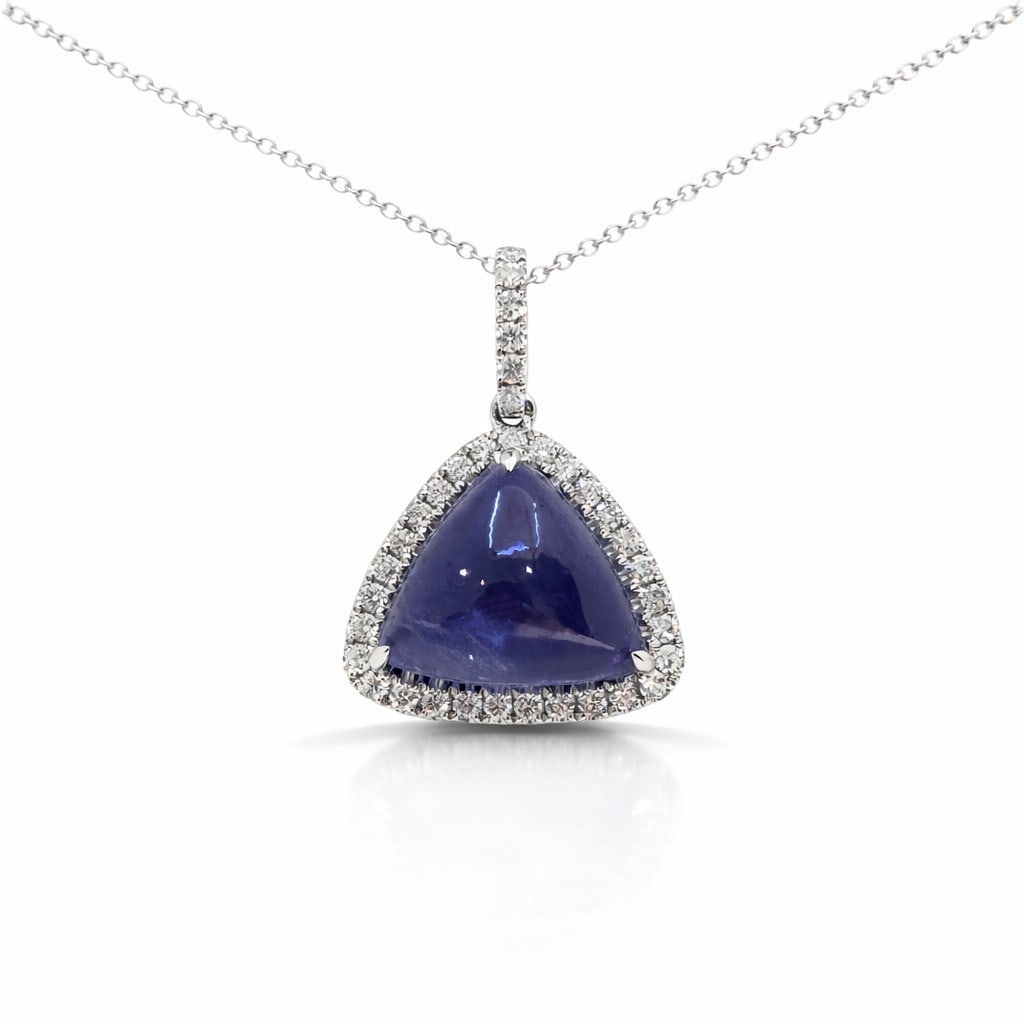 9.50ct Tanzanite and 0.42ctw Diamond 14K White Gold Pendant: An exquisite masterpiece of haute joaillerie, this magnificent Halo pendant featuring Tanzanite, White Diamond is a true treasure. Crafted with precision, the Halo setting is seamlessly integrated int