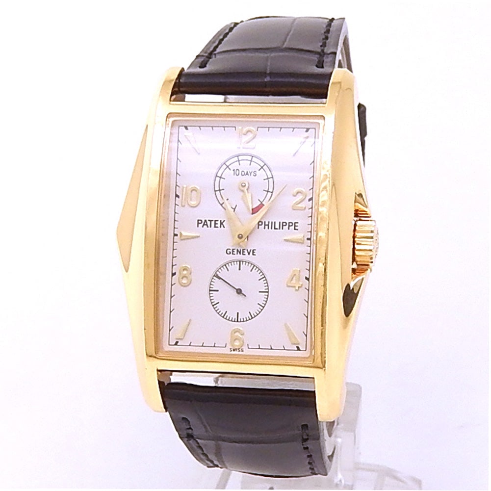Patek Philippe Gondolo 10 Days Power Reserve 5100J-001 18k Yellow Gold Silver Dial: The Patek Philippe Gondolo 10 Days Power Reserve, Reference 5100J-001, is an extraordinary fusion of sculptural Art Deco styling and modern horological mastery. Crafted in luxurious 18k yellow gold, t