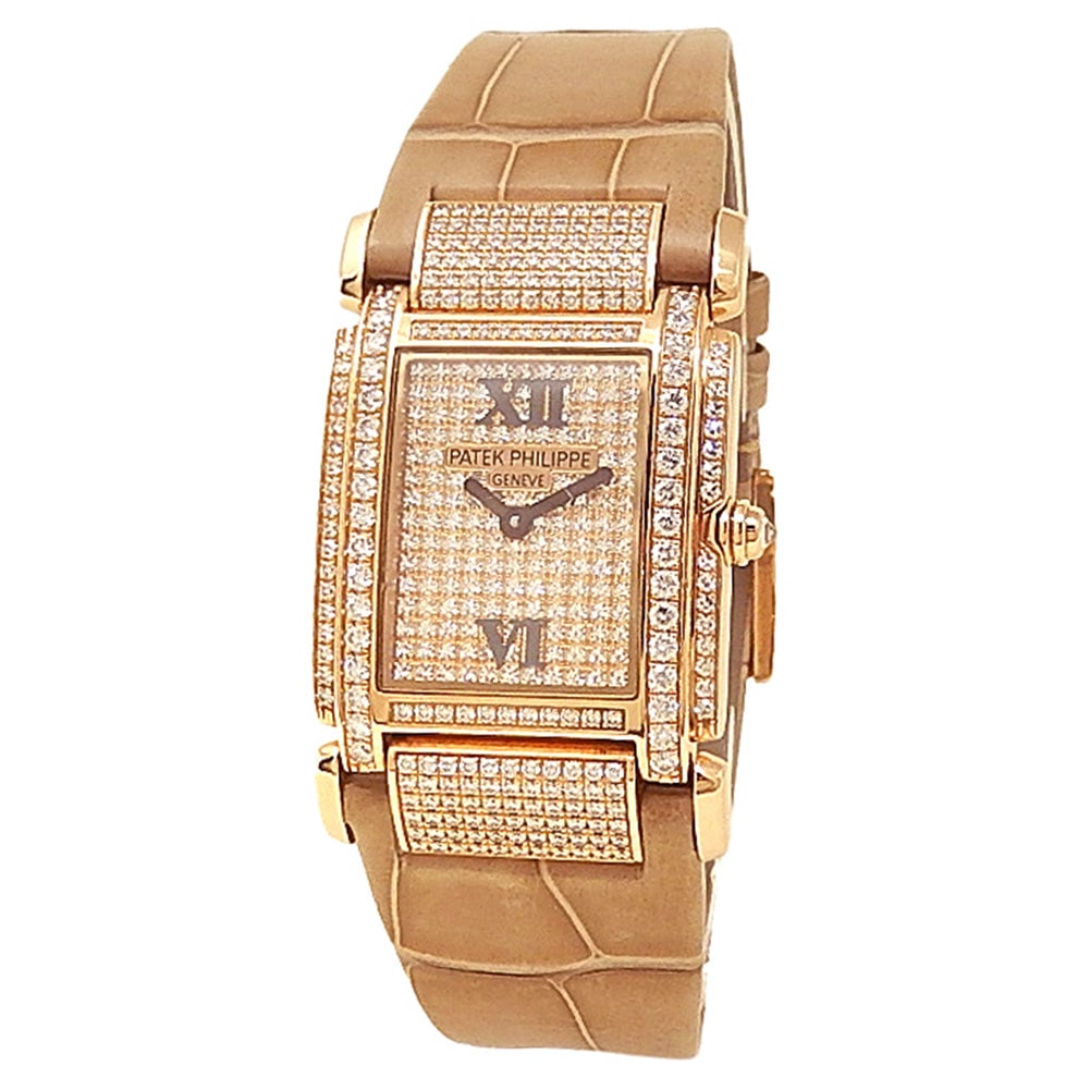 Patek Philippe Twenty-4 4910R-001 18k Rose Gold Diamond Pave Dial: The Patek Philippe Twenty-4, Reference 4910R-001, is the ultimate statement of timeless luxury and feminine grace. Crafted from brilliant 18k rose gold, this exquisite timepiece features a striking di