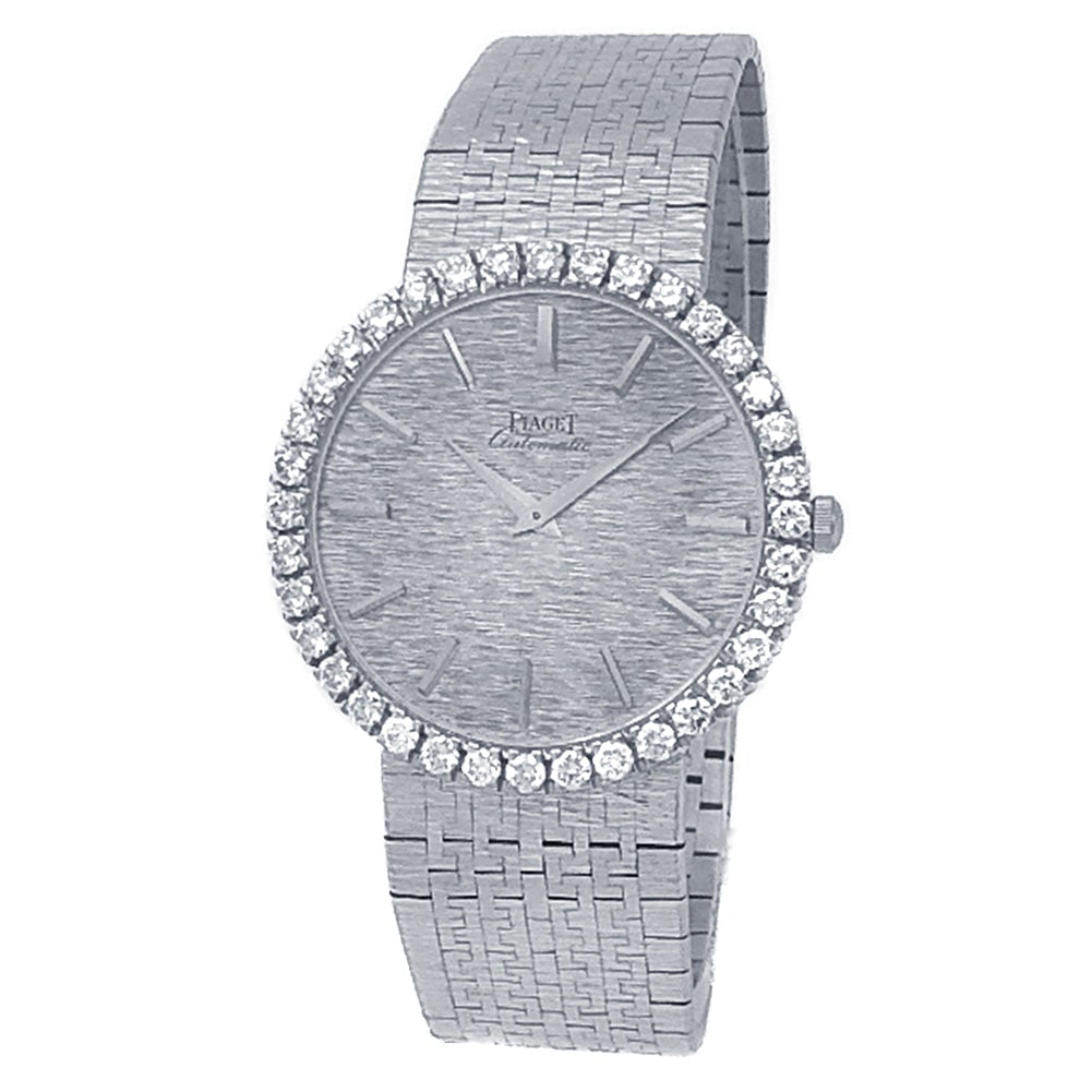 Piaget Vintage 12336 A6 18k White Gold Diamond Silver Dial: The Piaget Vintage, Reference 12336 A6, is a superb expression of classic elegance and mid-century luxury. Exceptionally crafted in 18k white gold, this exquisite dress watch features a stunning Silve