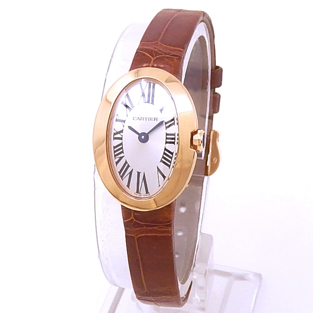 Cartier Mini Baignoire W8000017 18k Rose Gold Silver Dial: The Cartier Mini Baignoire, Reference W8000017, is an exquisite expression of refined elegance and timeless design. Crafted in 18k Rose Gold, its gently curved oval case perfectly complements the radi