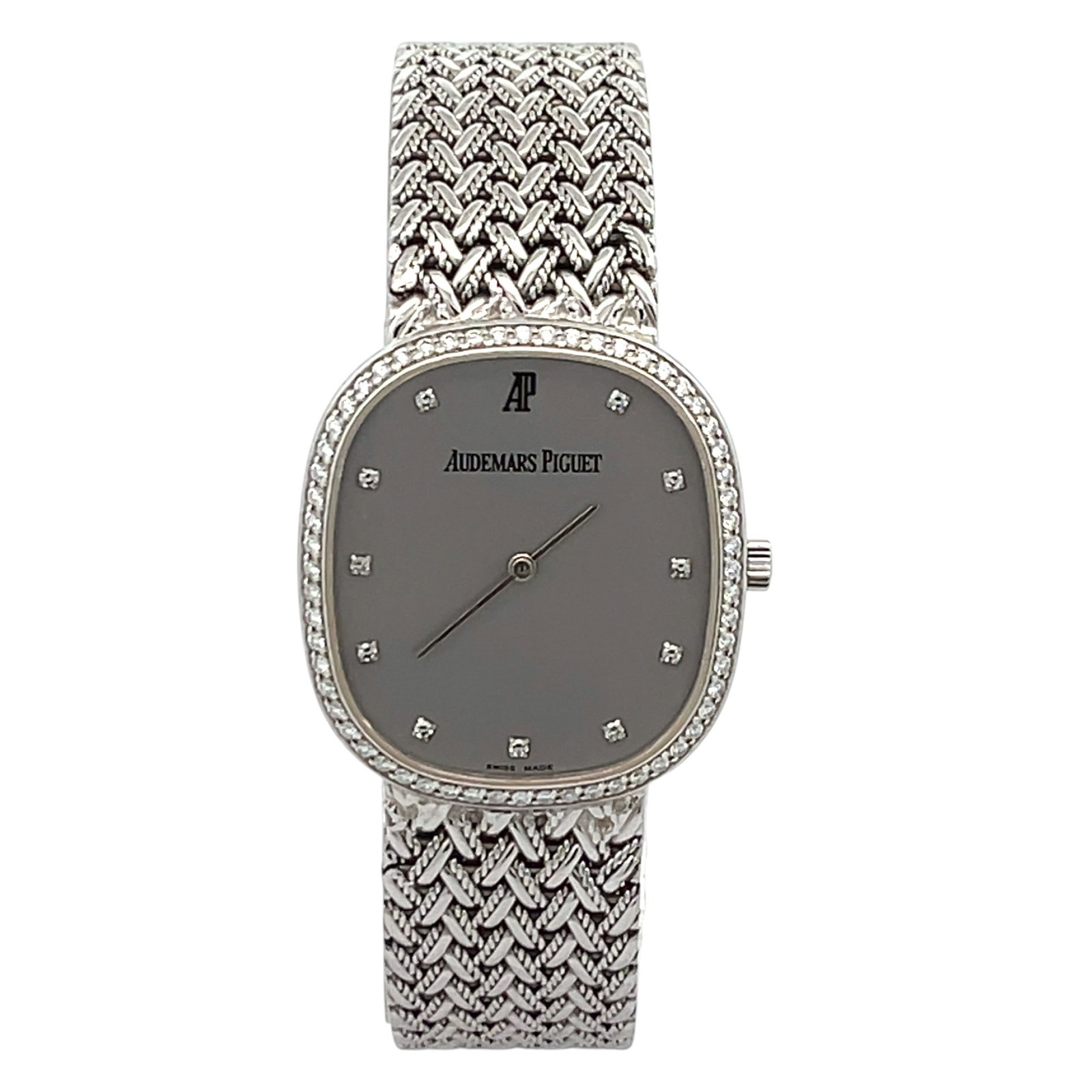 Audemars Piguet Vintage 14653BC White Gold Silver Diamond Dial & Diamond Bezel: The Audemars Piguet Vintage, Reference 14653BC, is a remarkable expression of mid-century elegance. Crafted in luminous white gold, this unisex timepiece features a dazzling diamond-set bezel that