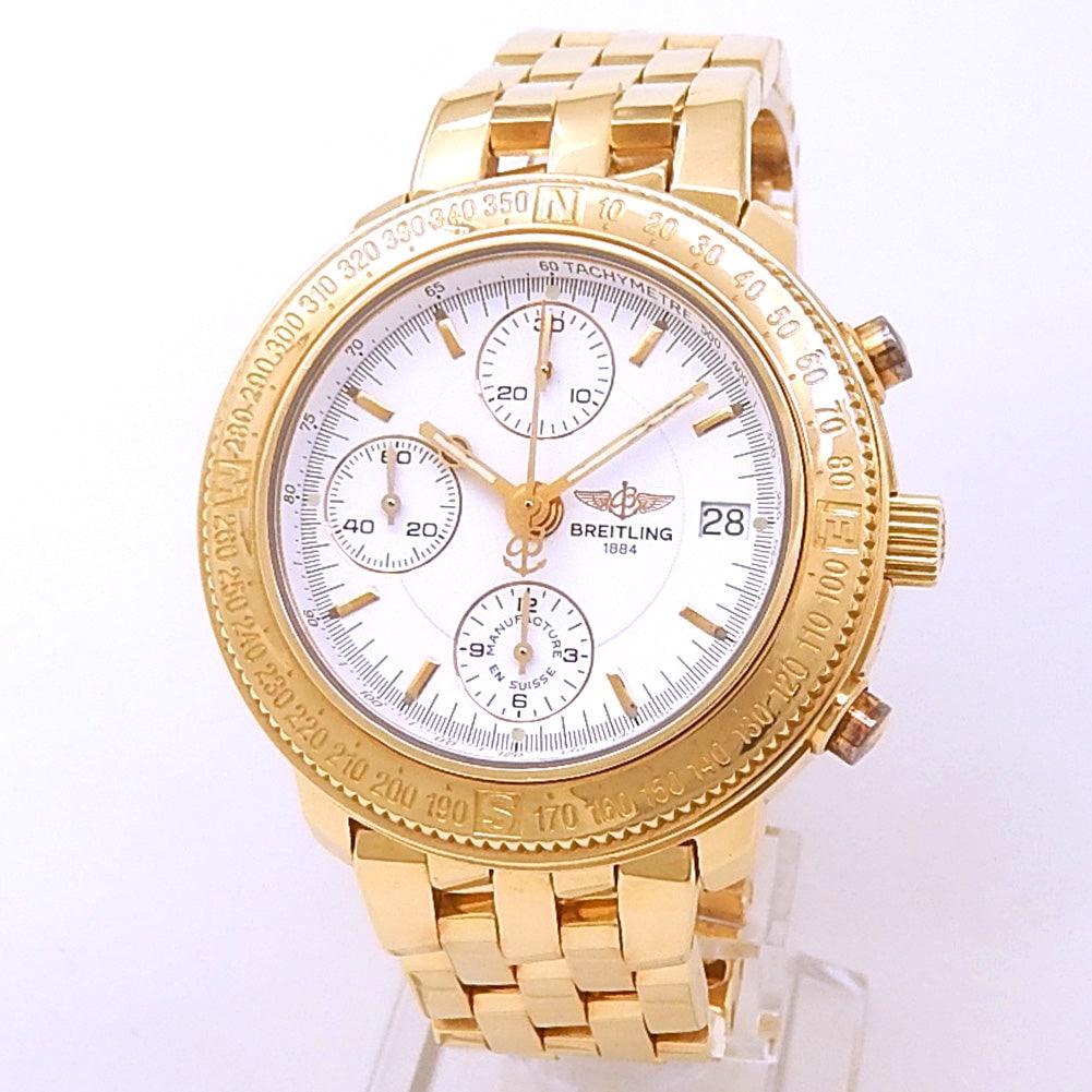 Breitling Astromat Longitude K20405 18k Yellow Gold White Dial: Breitling Astromat Longitude, Reference K20405, showcases timeless elegance with its 18k yellow gold case and bracelet. The watch features a crisp white dial with applied gold indexes, a practical