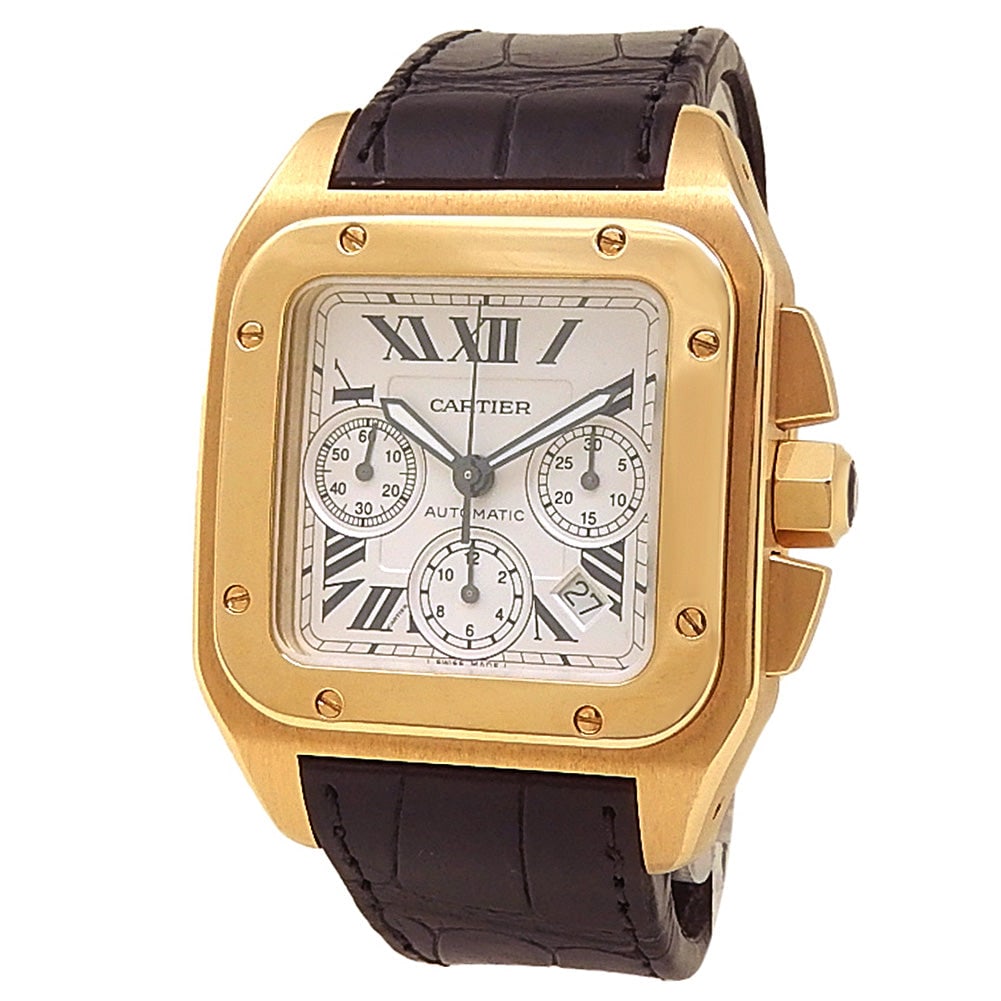 Cartier Santos 100 XL W20096Y1 18k Yellow Gold Silver Dial: The Cartier Santos 100 XL, Reference W20096Y1, is a superb expression of classic aviation heritage and contemporary luxury. Crafted in radiant 18k yellow gold, this landmark timepiece features a class