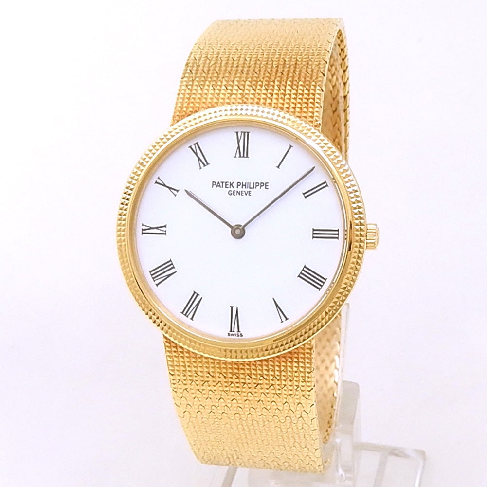 Patek Philippe Calatrava 3954/1 18k Yellow Gold White Dial: The Patek Philippe Calatrava, Reference 3954/1, is the quintessence of classic understatement and high horology. Crafted in lustrous 18k yellow gold, this dress watch features a pristine white dial