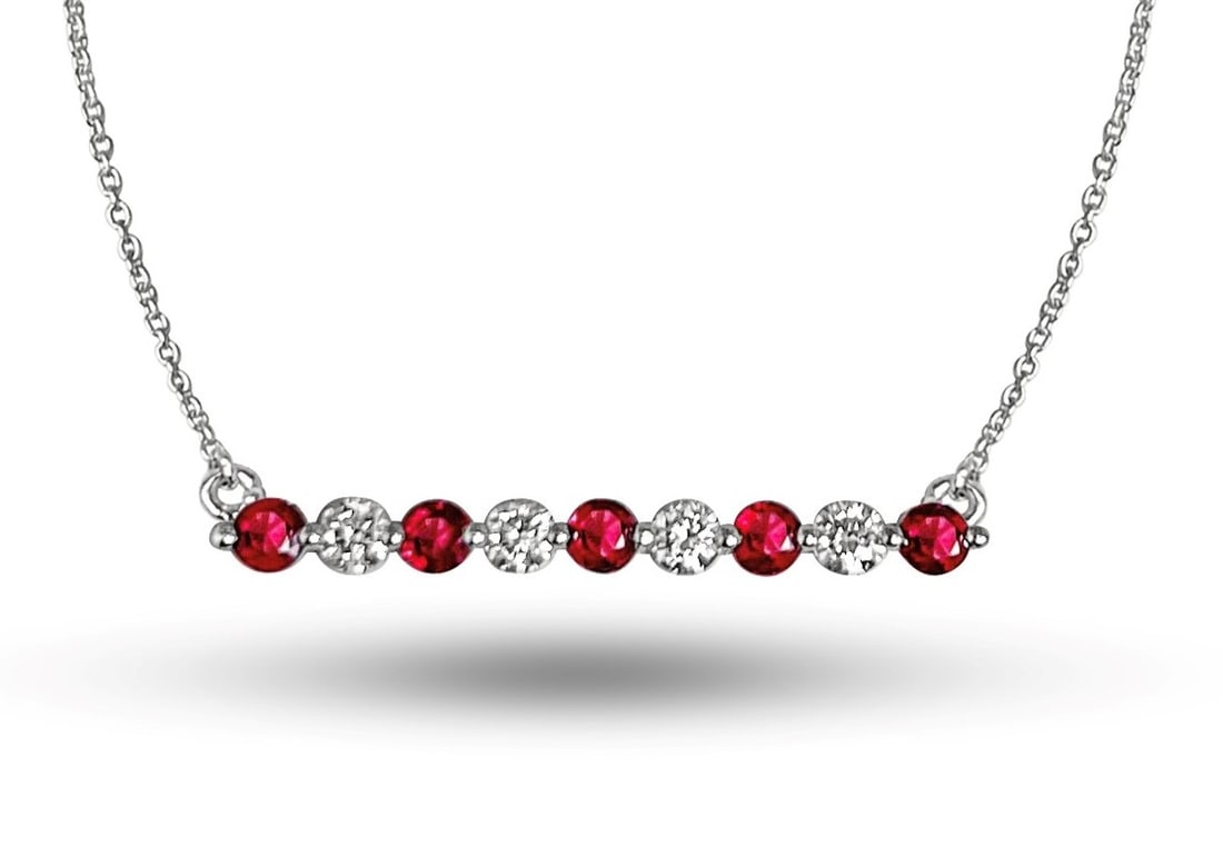 0.84ctw Ruby and 0.33ct Diamond 14K White Gold Straight Bar Pendant: Timeless and sophisticated, this elegant Alternating Straight Bar pendant featuring Ruby, White Diamond radiates enduring beauty. The gemstones are nestled within a Bar framework, supported by a subst