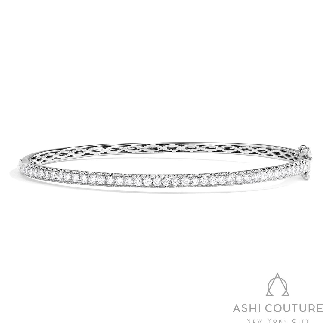 1.04 ctw White Diamond 18K White Gold Bangle Bracelet: A testament to superior craftsmanship, this elegant Timeless bangle bracelet featuring White Diamond is unparalleled. A detailed Line/Row Setting gallery secures the stones, rendered in 11.0 grams of 