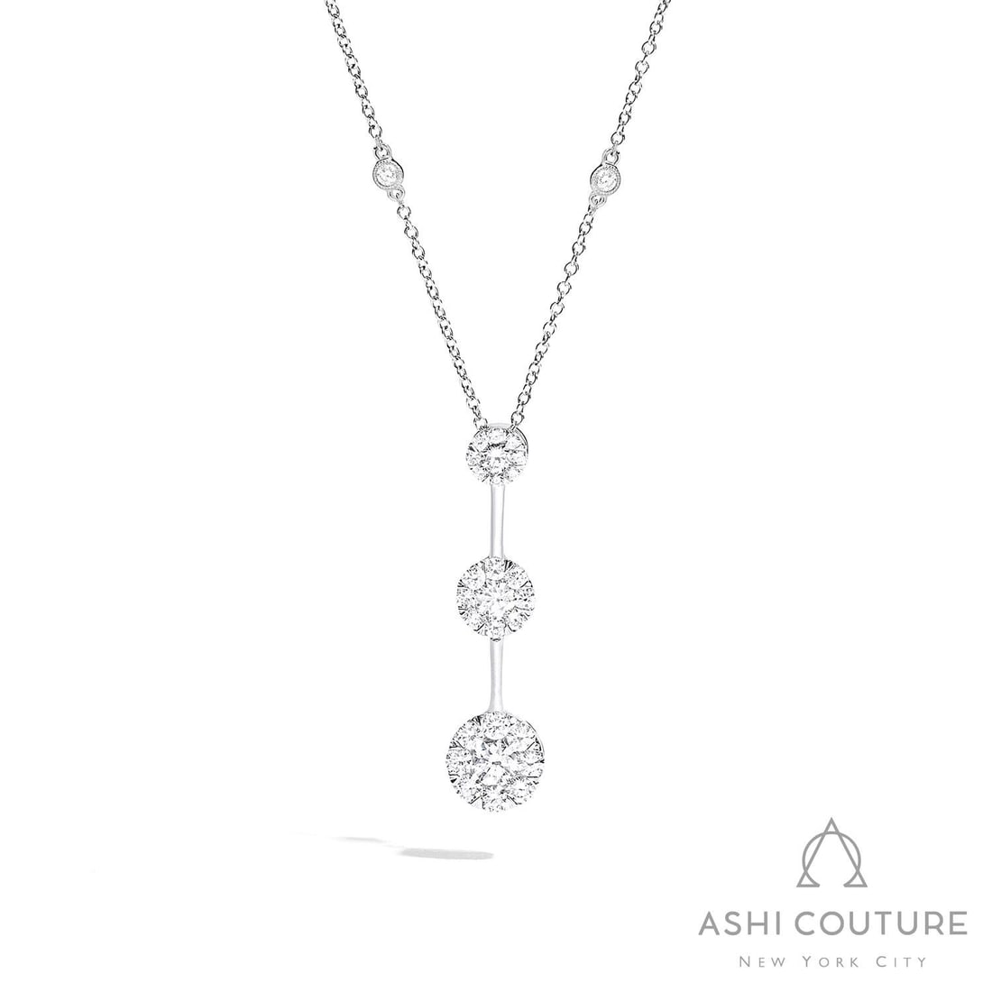 1.09 ctw Diamond 18K White Gold Pendant Necklace: A symphony of light and color, this breathtaking Cluster necklace featuring White Diamond embodies the pinnacle of luxury. Securely held in a classic Drop/Station design, the necklace is forged from 1