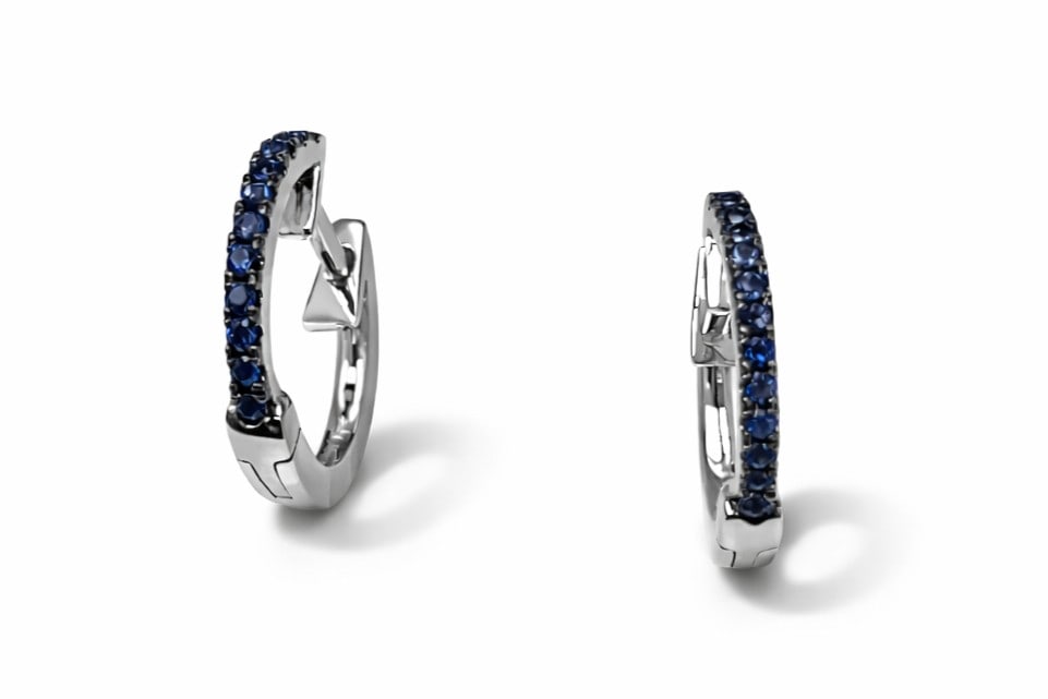 0.20ctw Blue Sapphire 14K White Gold Huggies Earrings: Exuding opulence and grace, this elegant Huggies pair of earrings featuring Blue Sapphire is crafted for the distinguished. Crafted with precision, the Shared Prong setting is seamlessly integrated in
