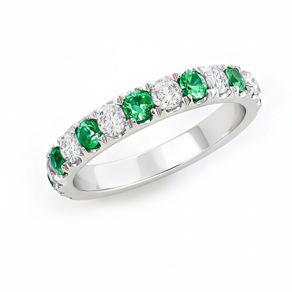 0.62ct Emerald 0.64ct Diamond Alternating Band 14K White Gold Ring: Defining modern elegance, this stunning Alternating Band ring featuring Emerald, White Diamond captures the essence of style. Securely held in a classic Shared Prong Band design, the ring is forged fr
