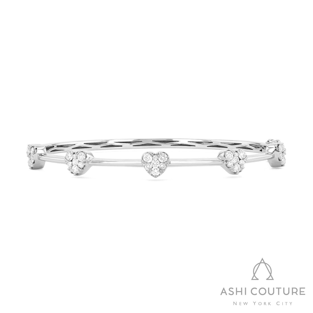 1.19 ctw White Diamond Fiori Heart Bar Cluster 18K White Gold Bangle: Exuding opulence and grace, this magnificent Fiori Heart Bar Cluster bangle featuring White Diamond is crafted for the distinguished. Showcasing the gems in a Cluster arrangement, the bangle consists 