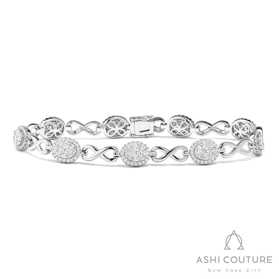 2.25 ctw Diamond Fiori Infinity 18K White Gold Link Bracelet: Captured in a moment of brilliance, this breathtaking Fiori Oval And Infinity Alternating bracelet featuring White Diamond speaks to the connoisseur. The gemstones are nestled within a Cluster framewo