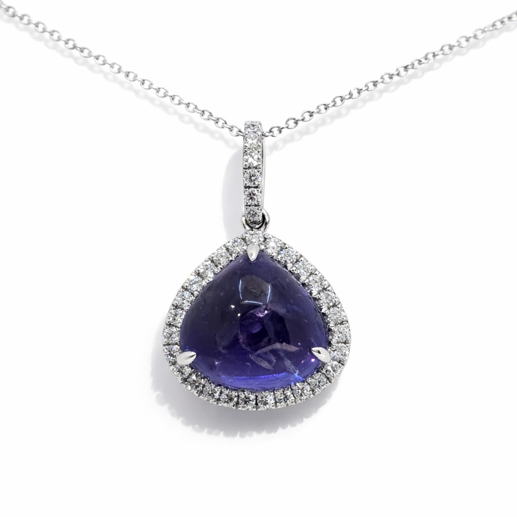 9.29ctw Tanzanite and 0.39ctw Diamond 14K White Gold Pendant: Defining modern elegance, this stunning Halo pendant featuring Tanzanite, White Diamond captures the essence of style. The gemstones are nestled within a Halo framework, supported by a substantial 1.7