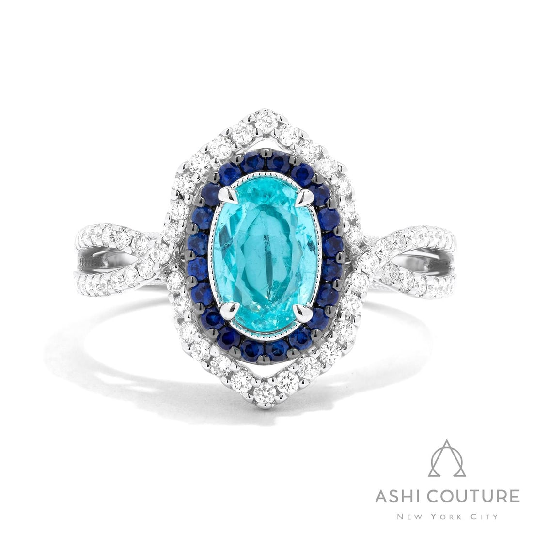 Oval Aquamarine, Sapphire & 0.37 ctw Diamond 18K White Gold Ring: Retail Value: $18,000 A testament to superior craftsmanship, this magnificent Split Shank ring featuring Aquamarine, Blue Sapphire, White Diamond is unparalleled. The gemstones are nestled within a Do