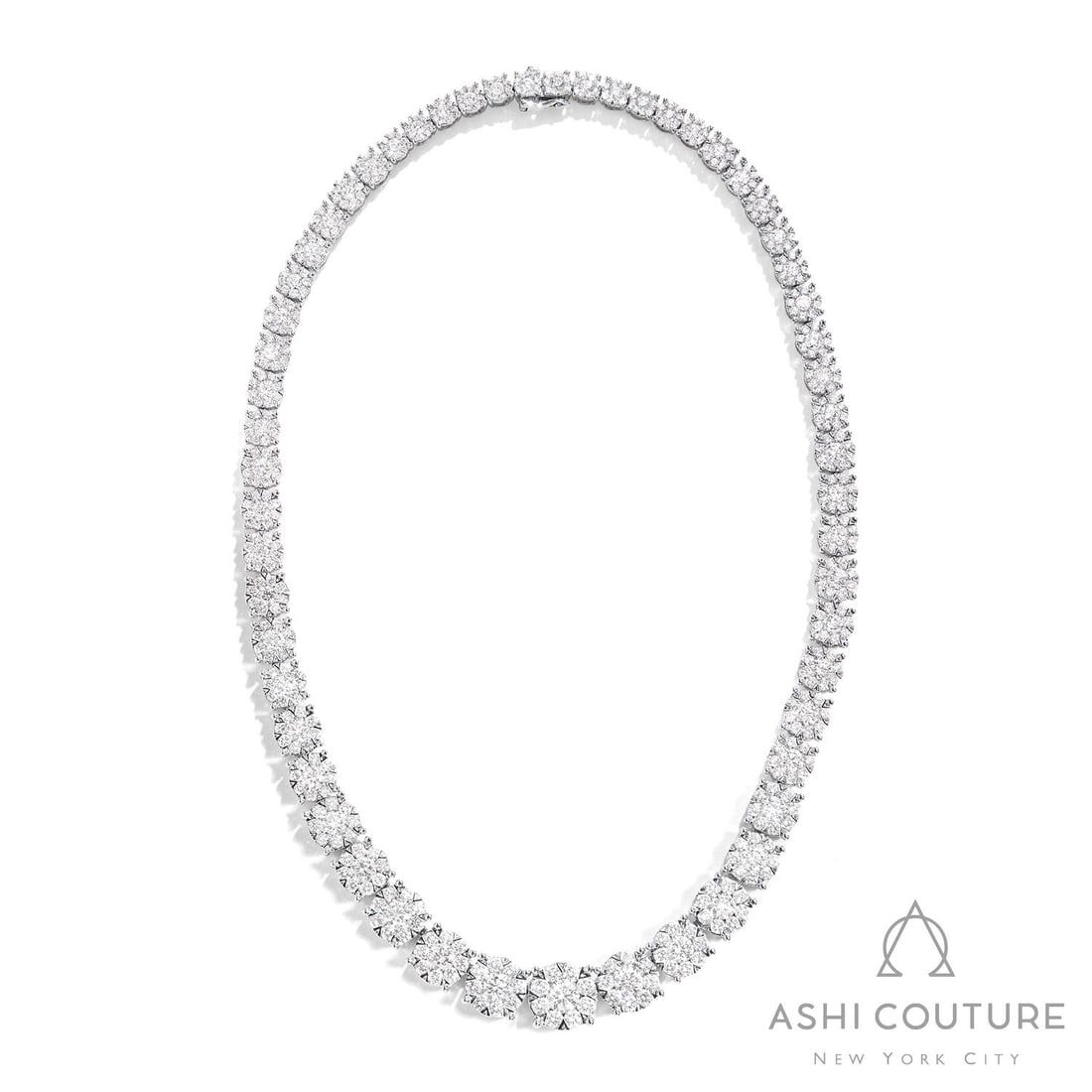 29.96 ctw White Diamond Fiori Eternity Riviera Cluster 18K White Gold Necklace: An exquisite masterpiece of haute joaillerie, this breathtaking Fiori Eternity Riviera Cluster necklace featuring White Diamond is a true treasure. A detailed Cluster gallery secures the stones, rende