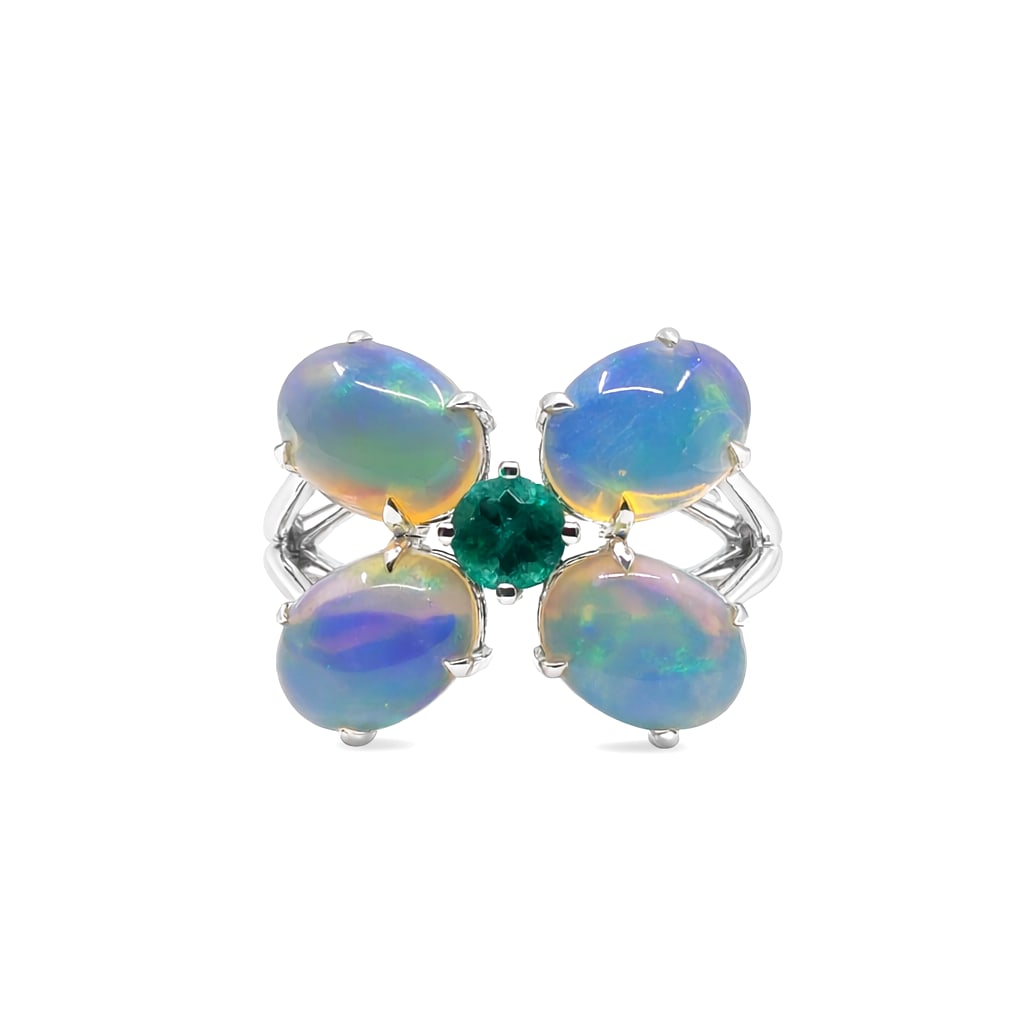 3.10ct Oval Opal and 0.29ctw Emerald Butterfly 14K White Gold Ring: Exuding opulence and grace, this breathtaking Butterfly ring featuring Opal, Emerald is crafted for the distinguished. A detailed Cluster gallery secures the stones, rendered in 3.68 grams of lustrous
