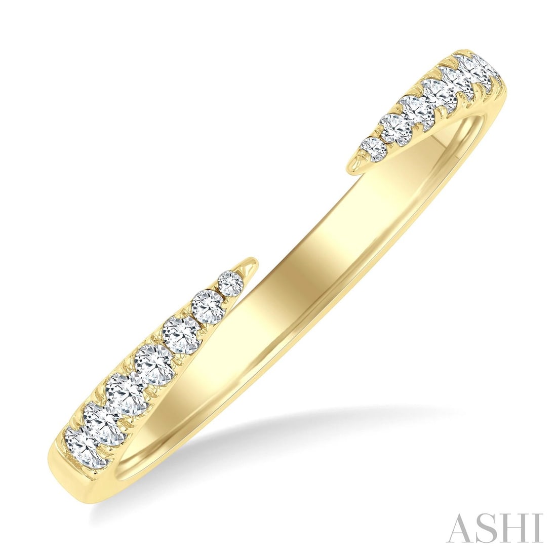 0.20 ctw Graduated Diamond Claw Open Fashion 14K Yellow Gold Ring: A testament to superior craftsmanship, this stunning Claw Open Fashion ring featuring White Diamond is unparalleled. A detailed Bypass gallery secures the stones, rendered in 2.3 grams of lustrous 14K
