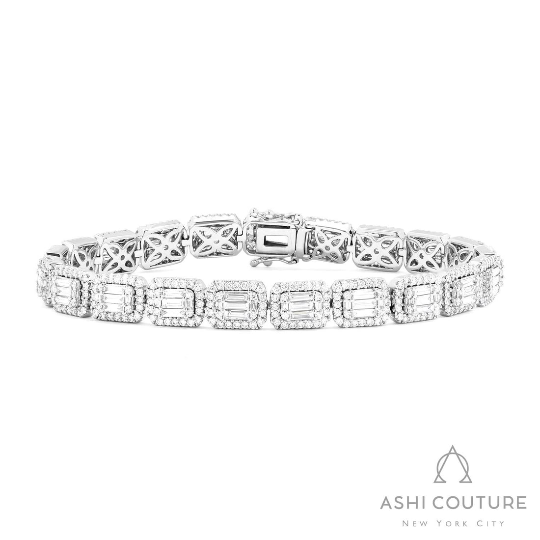 4.27 ctw Baguette and Round Diamond 18K White Gold Tennis Bracelet: Rare and radiant, this stunning Baguette Tennis bracelet featuring White Diamond offers a touch of the extraordinary. A detailed Cluster/Halo gallery secures the stones, rendered in 20.5 grams of lust