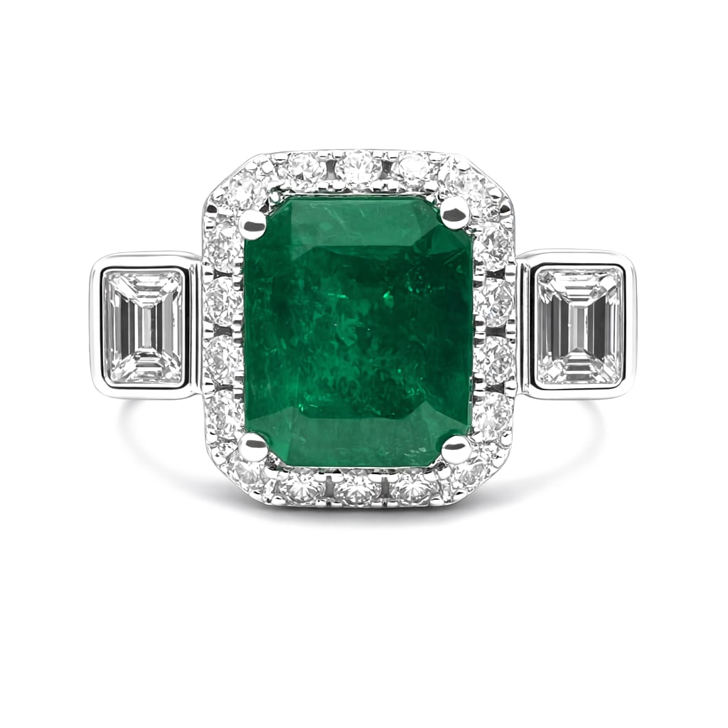 2.35ct Emerald 0.75ctw Diamond Three Stone Platinum Ring: A testament to superior craftsmanship, this magnificent Three Stone ring featuring Emerald, White Diamond is unparalleled. Crafted with precision, the Three-Stone, Halo setting is seamlessly integrate
