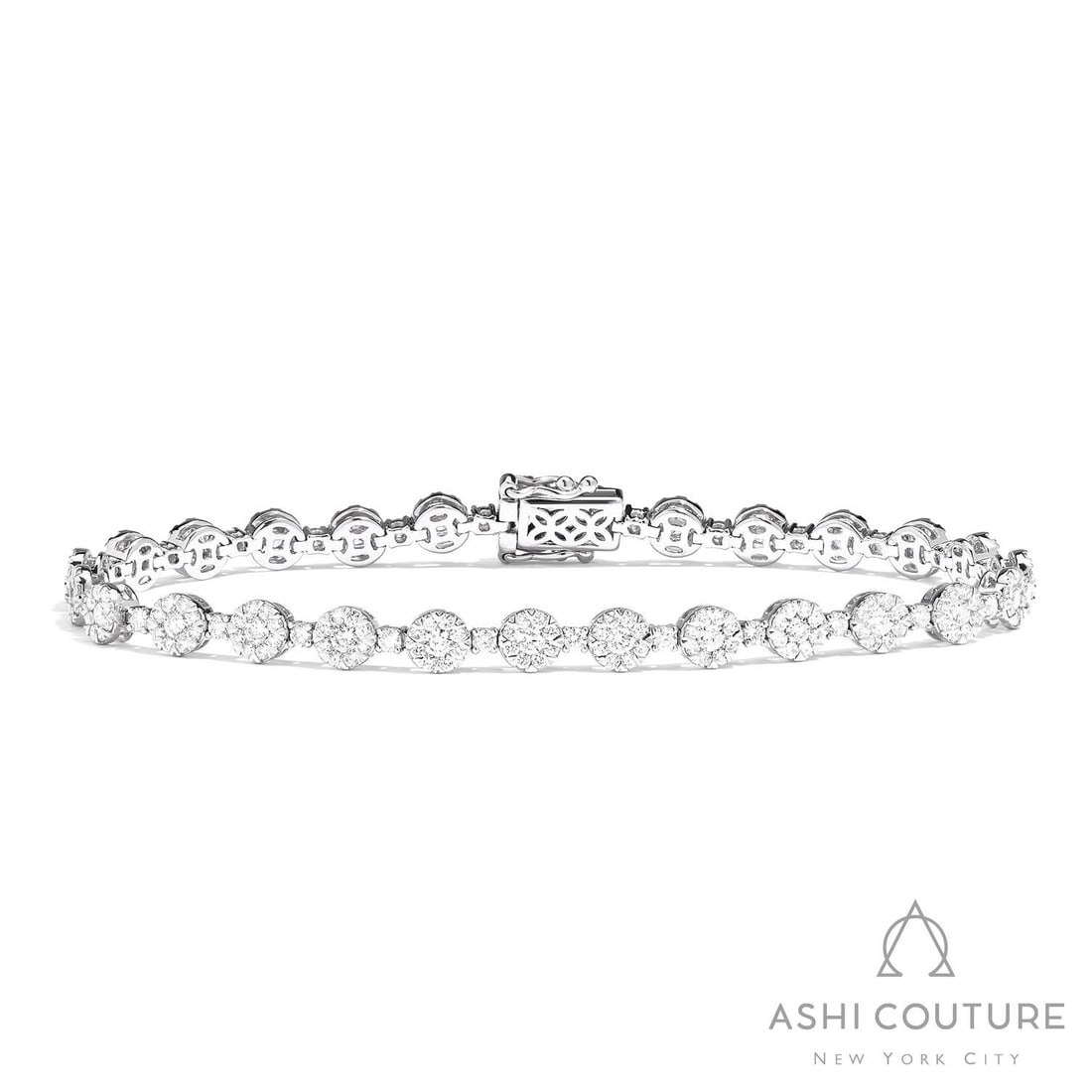 3.99 ctw White Diamond Fiori Station 18K White Gold Tennis Bracelet: A symphony of light and color, this breathtaking Fiori Station bracelet featuring Natural Diamonds embodies the pinnacle of luxury. Securely held in a classic Cluster design, the bracelet is forged fr