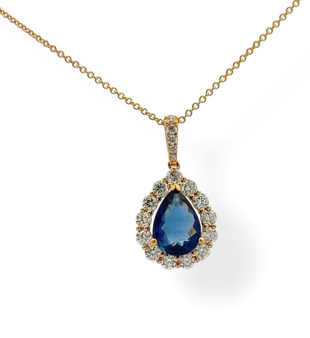 2.03ct Blue Sapphire and 0.72ctw Diamond 18K Yellow Gold Pendant: A vision of luxury, this exquisite Halo pendant featuring Blue Sapphire, White Diamond defines sophistication. The gemstones are nestled within a Halo framework, supported by a substantial 1.85 grams 