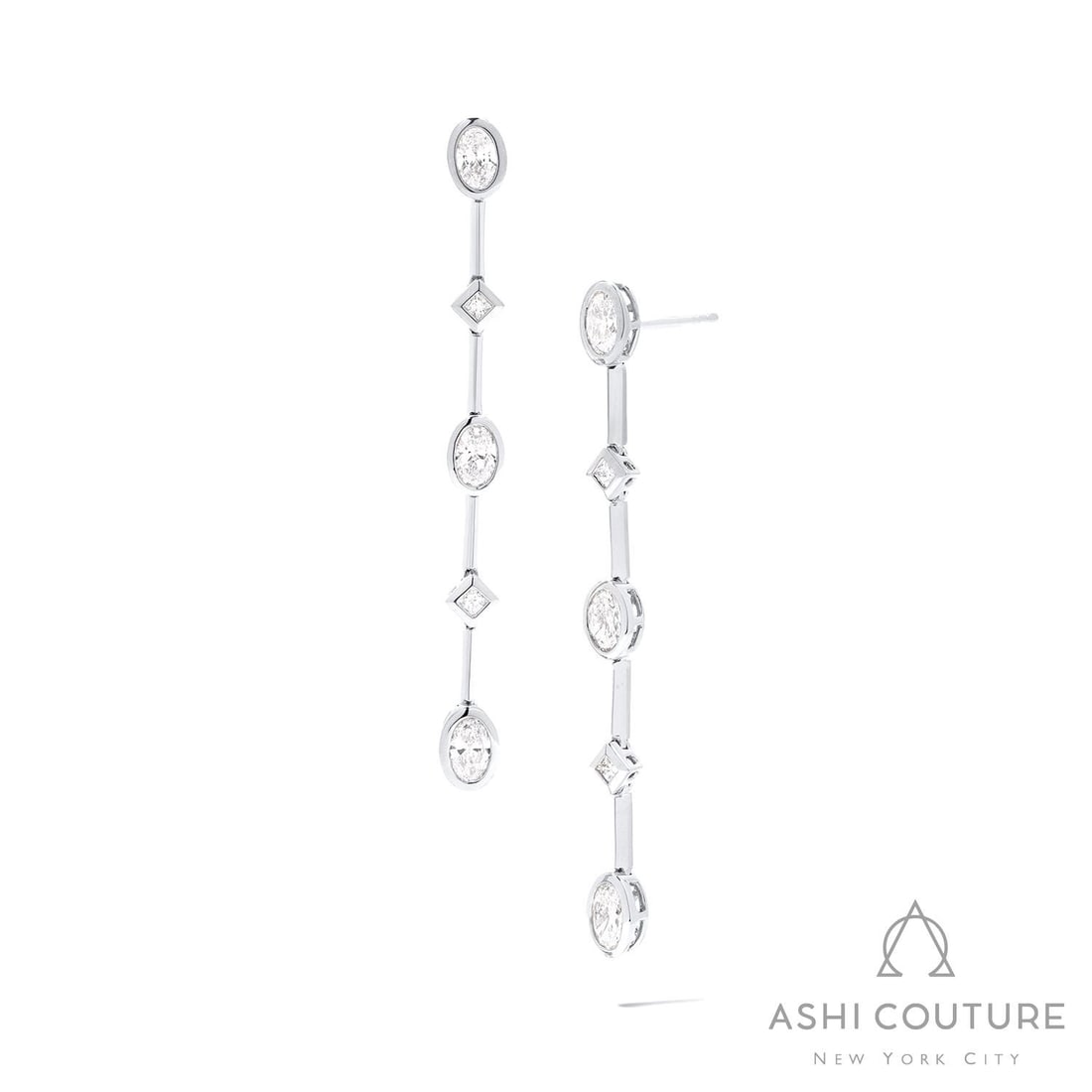 2.04 ctw Oval & Princess Cut Diamond 18K White Gold Drop Earrings: Exuding opulence and grace, this magnificent Bar pair of earrings featuring White Diamond is crafted for the distinguished. Showcasing the gems in a Bar arrangement, the earrings consist of 5.8 grams 