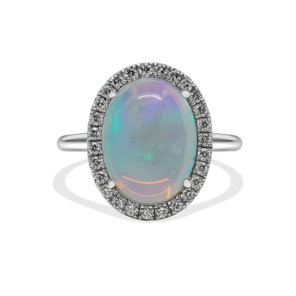 3.69ct Oval Opal and 0.33ctw Round Diamond 14K White Gold Ring: Timeless and sophisticated, this magnificent Halo ring featuring Opal, White Diamond radiates enduring beauty. Expertly mounted in a Halo setting, the ring is crafted in 3.86 grams of solid 14K White 