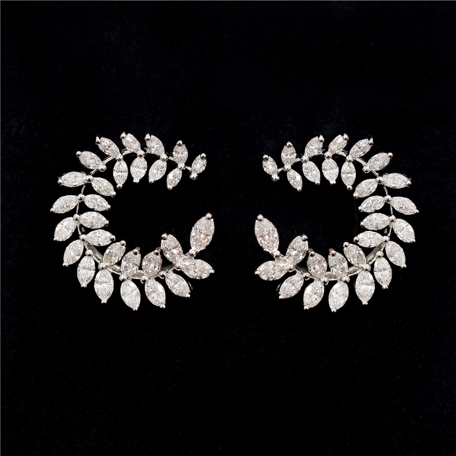 2.25 ctw White Diamond Leaf Design Platinum Earrings: Retail Value: $11,190 An exquisite masterpiece of haute joaillerie, this stunning Leaf Design pair of earrings featuring White Diamond is a true treasure. Showcasing the gems in a Cluster arrangement,