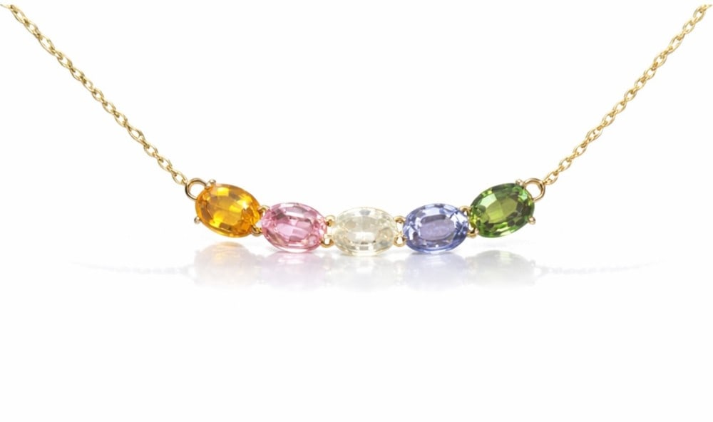 3.36ctw Multi Color Sapphire 14K Yellow Gold Curved Bar Pendant: Captured in a moment of brilliance, this stunning Curved Bar pendant featuring Yellow Sapphire, Pink Sapphire, Fancy Color Diamond, Blue Sapphire speaks to the connoisseur. Securely held in a classic 
