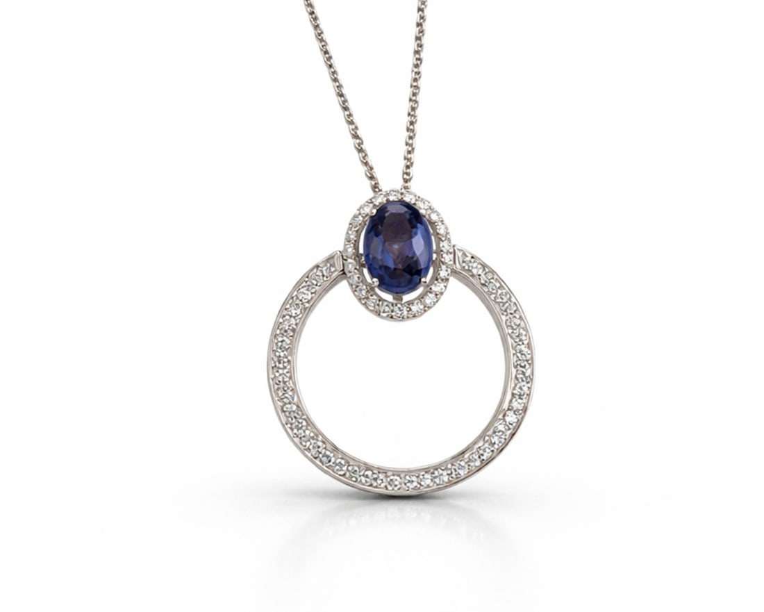 1.16ct Oval Blue Sapphire and 0.45ctw White Diamond 14K White Gold Pendant: Captured in a moment of brilliance, this stunning Halo pendant featuring Blue Sapphire, White Diamond speaks to the connoisseur. Expertly mounted in a Halo setting, the pendant is crafted in 0.0 g of 