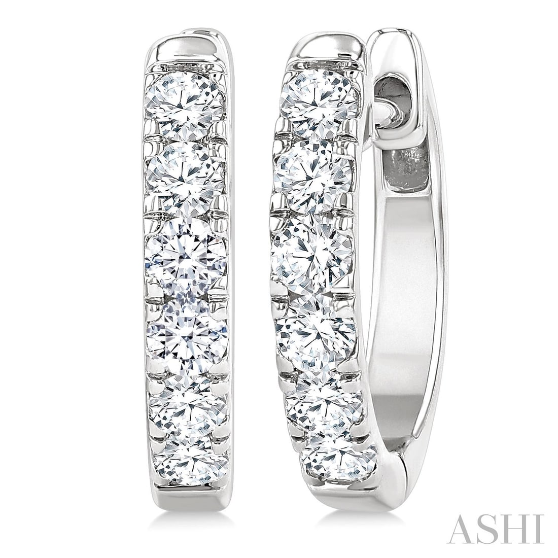 0.5 ctw White Diamond 14K White Gold Hoop Earrings: A testament to superior craftsmanship, this elegant Line Setting Hoop pair of earrings featuring White Diamond is unparalleled. A detailed Line gallery secures the stones, rendered in 2.35 g of lustro