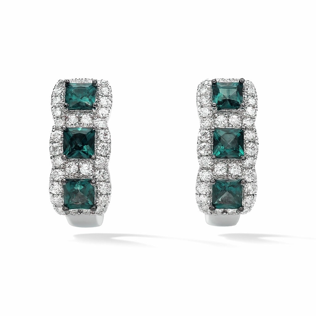 1.69ctw Alexandrite and 0.58ctw Diamond 14K White Gold Huggie Earrings: Exuding opulence and grace, this elegant Three-Stone pair of earrings featuring Alexandrite, White Diamond is crafted for the distinguished. Crafted with precision, the Halo setting is seamlessly inte