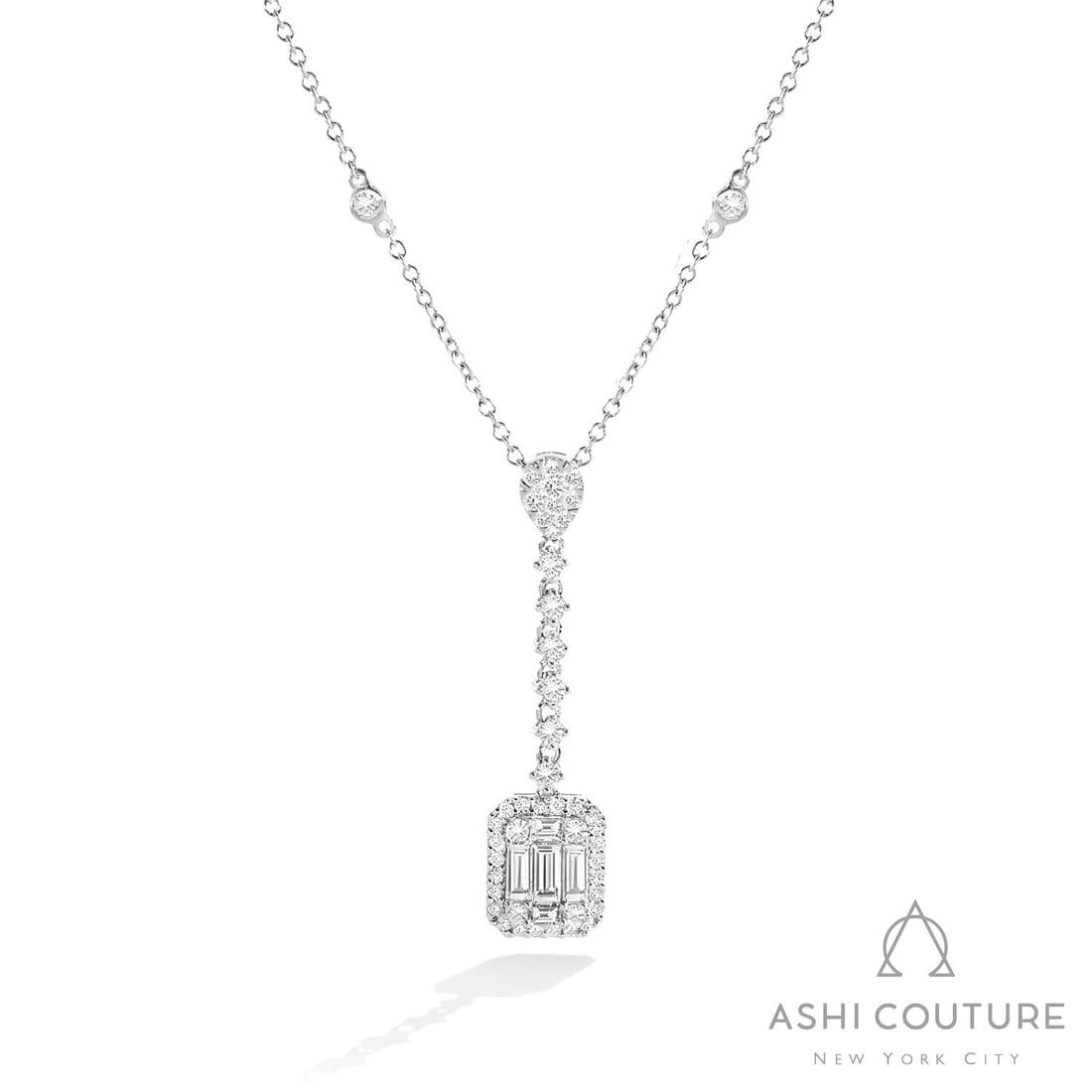 1.36 ctw Baguette Diamond Drop Cluster Pendant 18K White Gold Necklace: Exuding opulence and grace, this elegant Drop Cluster necklace featuring White Diamond is crafted for the distinguished. A detailed Cluster gallery secures the stones, rendered in 3.5 grams of lustrou