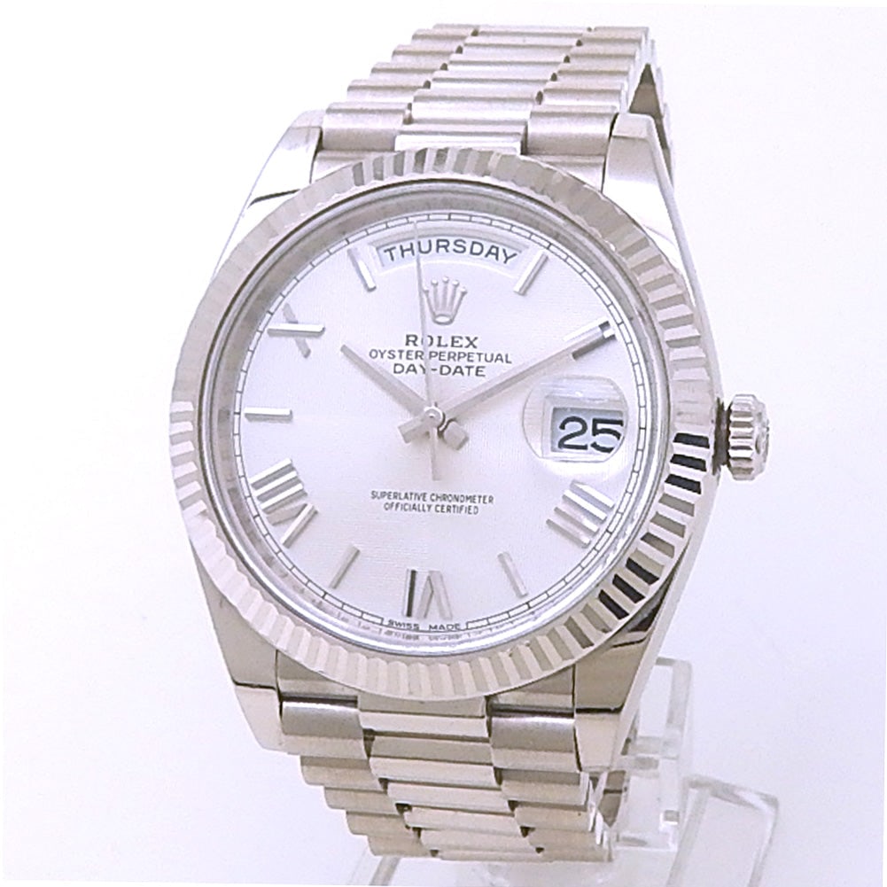 Rolex Day-Date 40 228239 18k White Gold Silver Dial: The Rolex Day-Date 40, Reference 228239, defines horological excellence with its distinguished presence. Crafted entirely in 18k White Gold, the 40mm case and signature President bracelet exude a subt