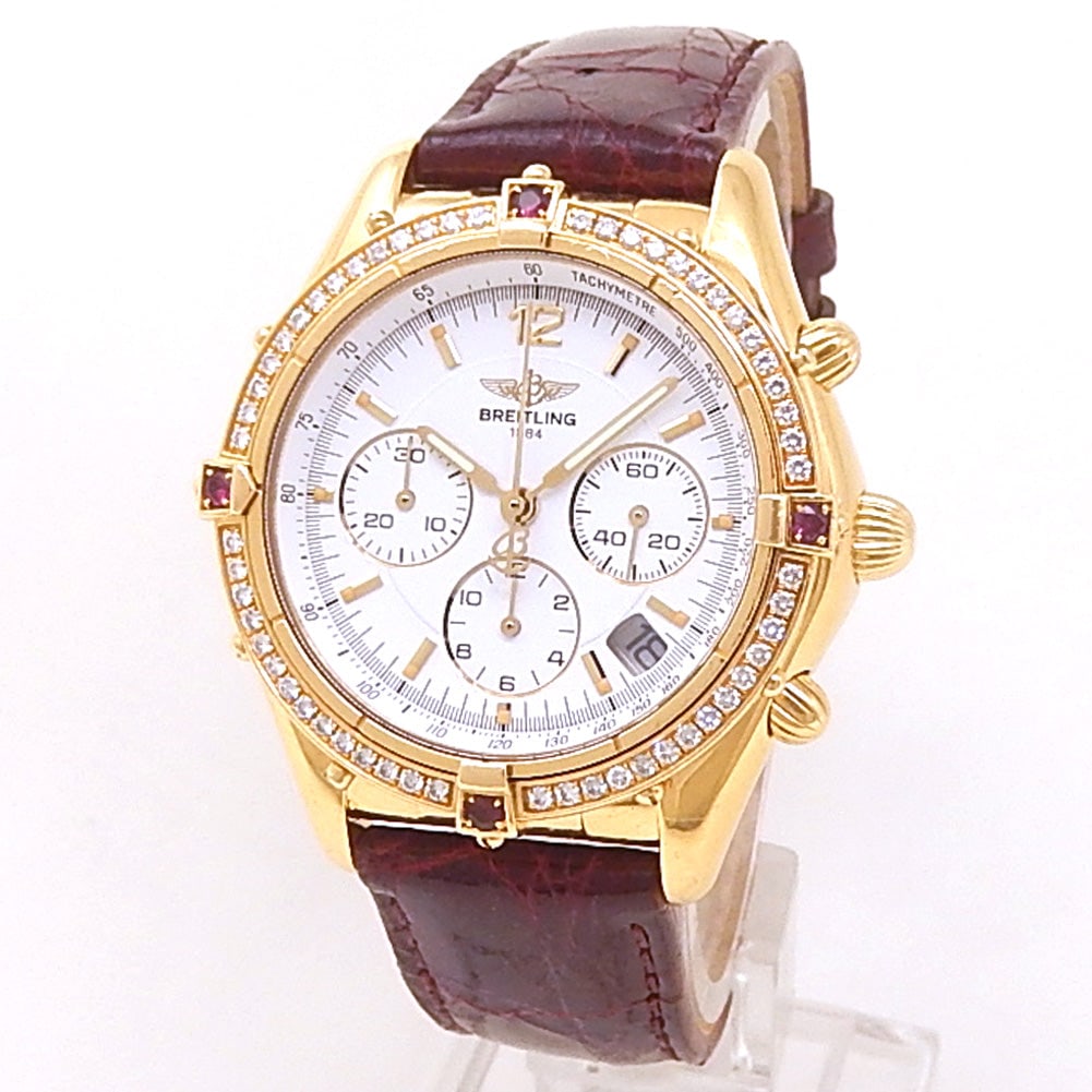 Breitling Chrono Cockpit K30012 18k Yellow Gold White Dial: The Breitling Chrono Cockpit, Reference K30012, is a superb expression of classic aviation heritage and elegant craftsmanship. Rendered in a brilliant and warm 18k yellow gold case, this striking watc