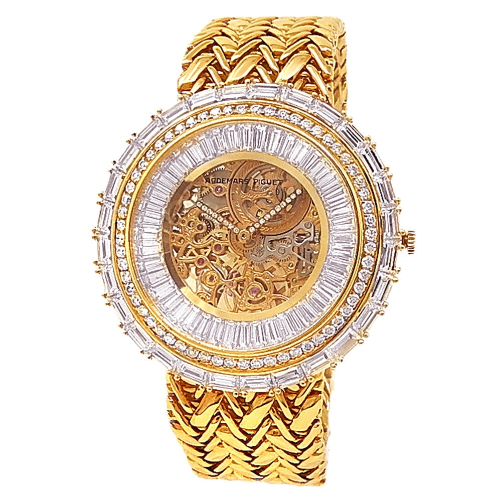 Audemars Piguet Vintage 18k Yellow Gold Skeleton Diamond Dial: The Audemars Piguet Vintage Skeleton represents an exquisite combination of high-jewelry artistry and traditional Swiss watchmaking. Crafted in lustrous 18k yellow gold, this remarkable timepiece feat