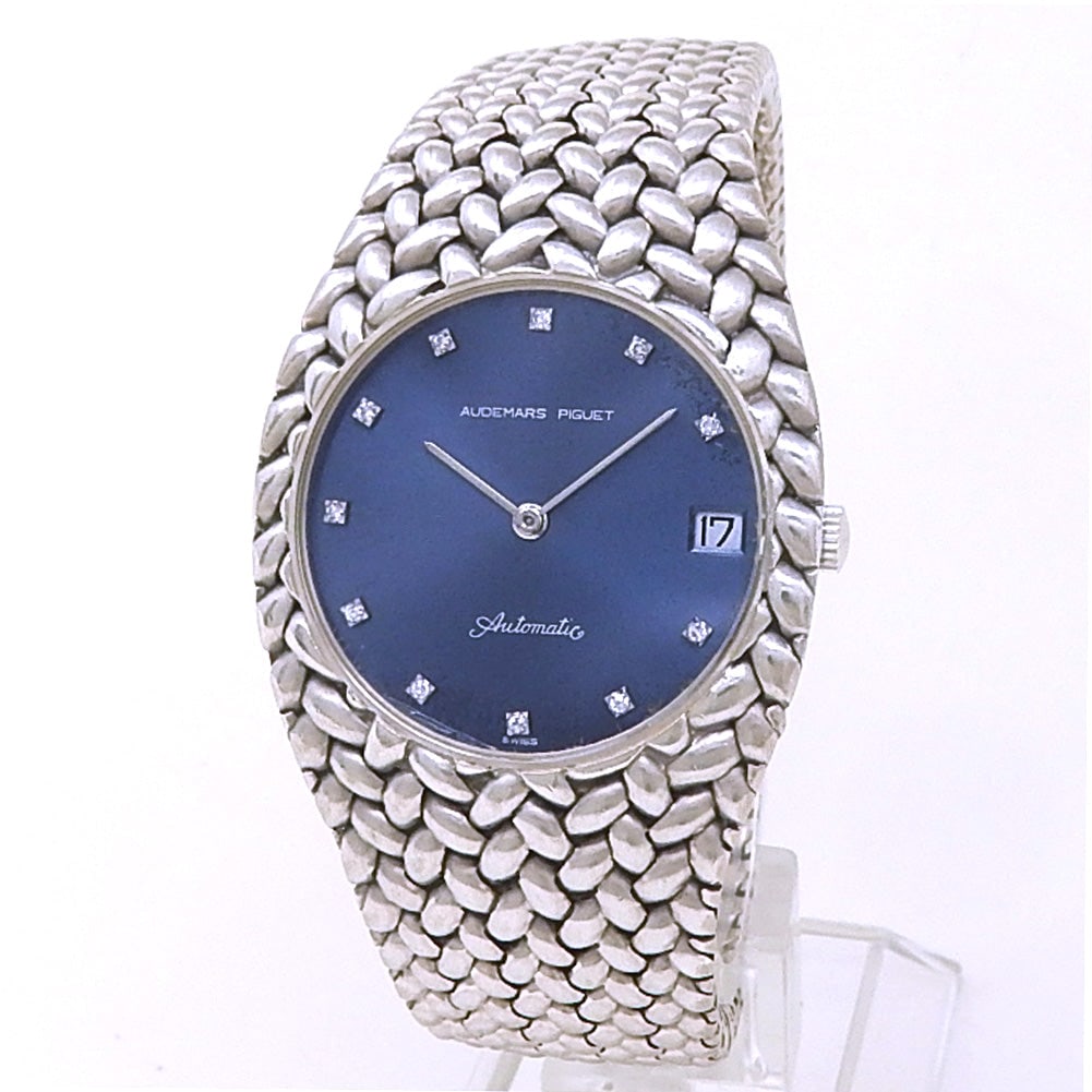 Audemars Piguet Cobra 18k White Gold Blue Diamond Dial: The Audemars Piguet Cobra is a masterpiece of vintage aesthetics and geometric precision. Crafted in a luxurious 18k white gold case, this rare timepiece features a deep Blue dial adorned with spa