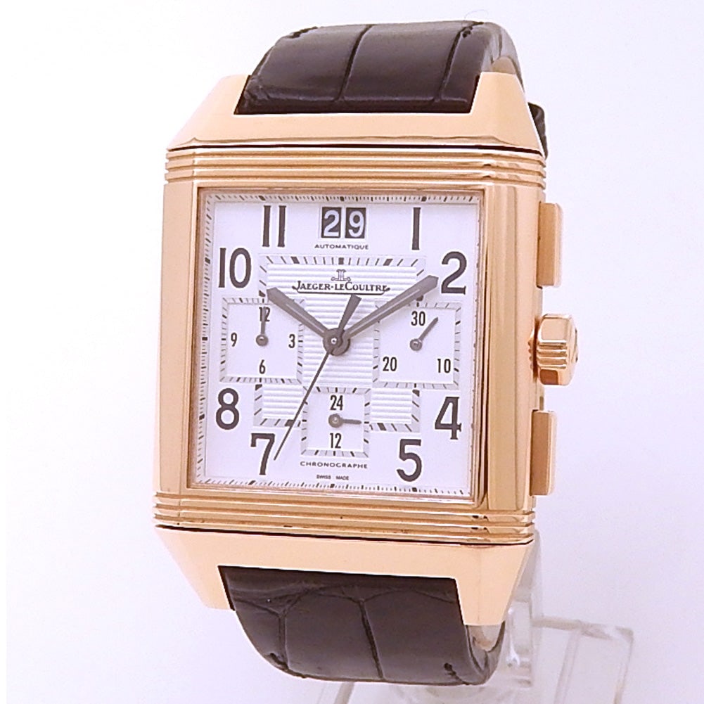 Jaeger-LeCoultre Reverso Squadra Chronograph GMT Q7012420 18k Rose Gold Silver Dial: The Jaeger-LeCoultre Reverso Squadra Chronograph GMT, Reference Q7012420, is an exceptional fusion of horological complexity and iconic design. Encased in luxurious 18k rose gold, the rectangular reve