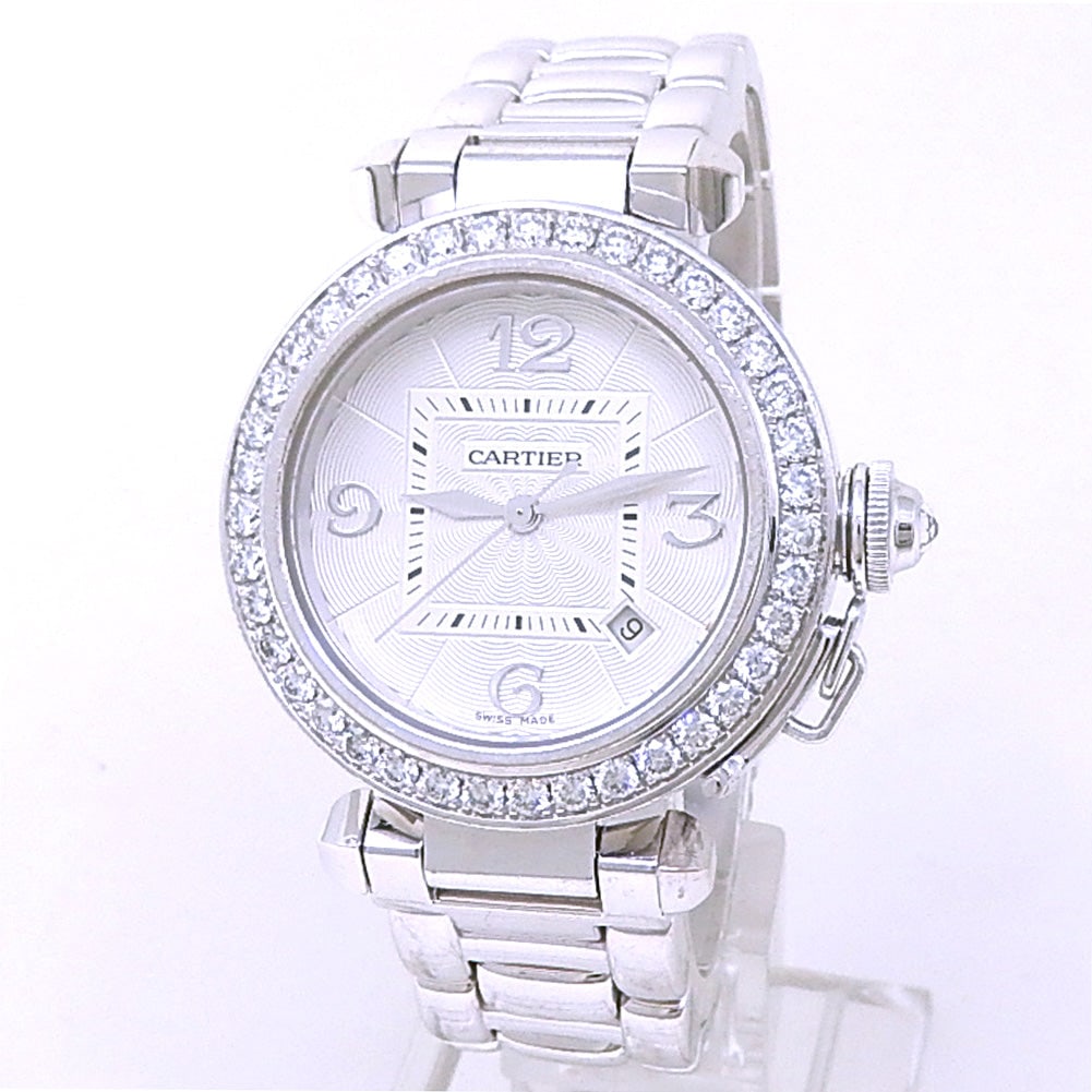 Cartier Pasha WJ1116M9 18k White Gold Diamond Bezel Silver Dial: The Cartier Pasha, Reference WJ1116M9, exudes opulent femininity. Encased in 18k white gold, this ladies' timepiece features a luminous silver dial adorned with a practical date window. The fixed