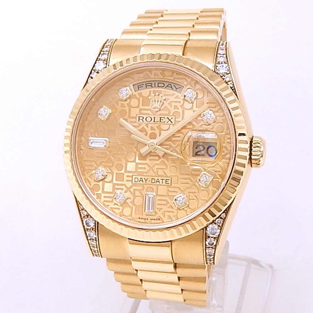 Rolex Day-Date 118338 18k Yellow Gold Champagne Jubilee Diamond Dial: The Rolex Day-Date, Reference 118338, is a paragon of luxury and prestige. This exquisite timepiece is rendered in 18k yellow gold, featuring a striking champagne jubilee dial adorned with brillia
