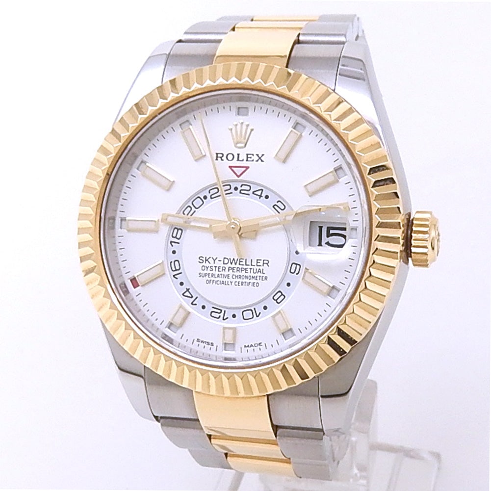 Rolex Sky-Dweller 326933 18k Yellow Gold & Stainless Steel Silver Dial: The Rolex Sky-Dweller, Reference 326933, is a masterful fusion of elegance and innovation. Encased in Rolex's distinguished 18k yellow gold and stainless steel Rolesor, this timepiece features a breat
