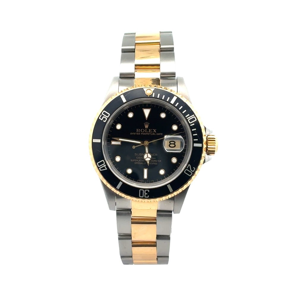 Rolex Submariner Date 40mm 16613 Two-Tone Black Dial: The Rolex Submariner Date, Reference 16613, is a masterpiece of diving heritage and timeless aesthetics. Crafted in a luxurious two-tone combination of stainless steel and 18K yellow gold, this timepi