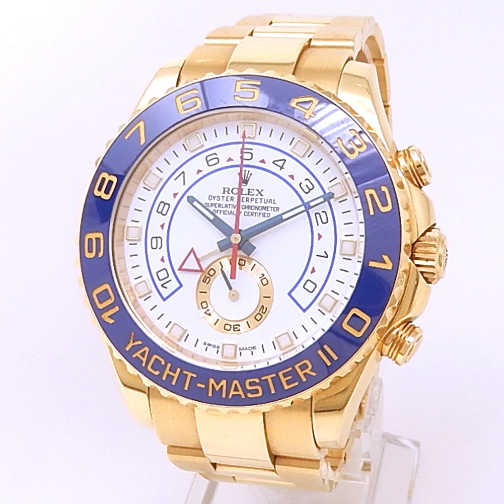 Rolex Yacht-Master II 116688 18k Yellow Gold White Dial: The Rolex Yacht-Master II, Reference 116688, is an extraordinary expression of maritime elegance and commanding presence. Expertly crafted in rich 18k yellow gold, this distinctive timepiece features 