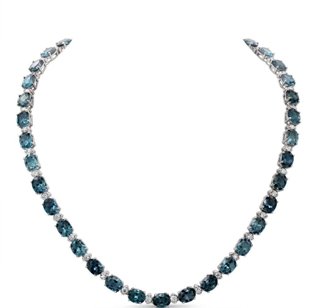London Blue Topaz and Diamond Necklace in 14K White Gold: Featured Collection: The Kelly Christie Collection Exclusively Curated By: Serenity Gallerie The Kelly Christie Collection crafts heirloom-quality masterpieces designed not just to adorn, but to captu