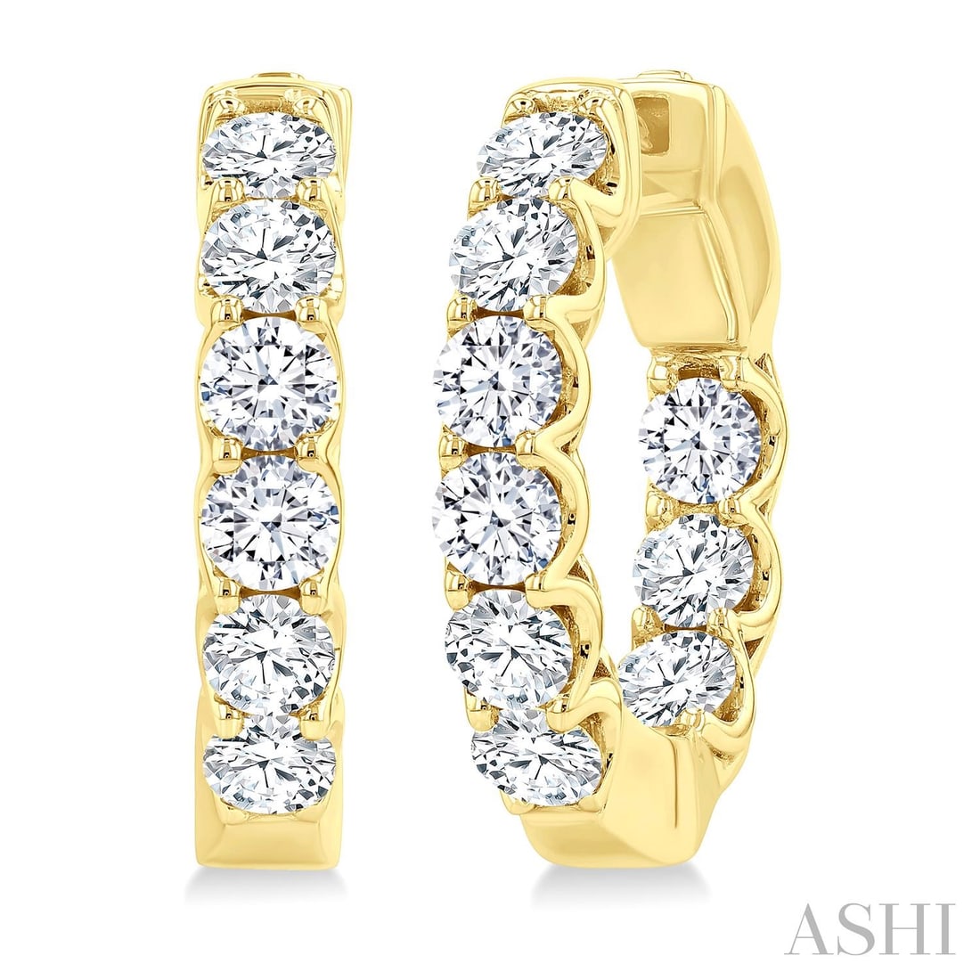 3.02 ctw Inside-Out Diamond Hoop Earrings 14K Yellow Gold: A vision of luxury, this elegant Inside-Out pair of earrings featuring Natural Diamonds defines sophistication. The gemstones are nestled within a Hoop framework, supported by a substantial 10.45 gram